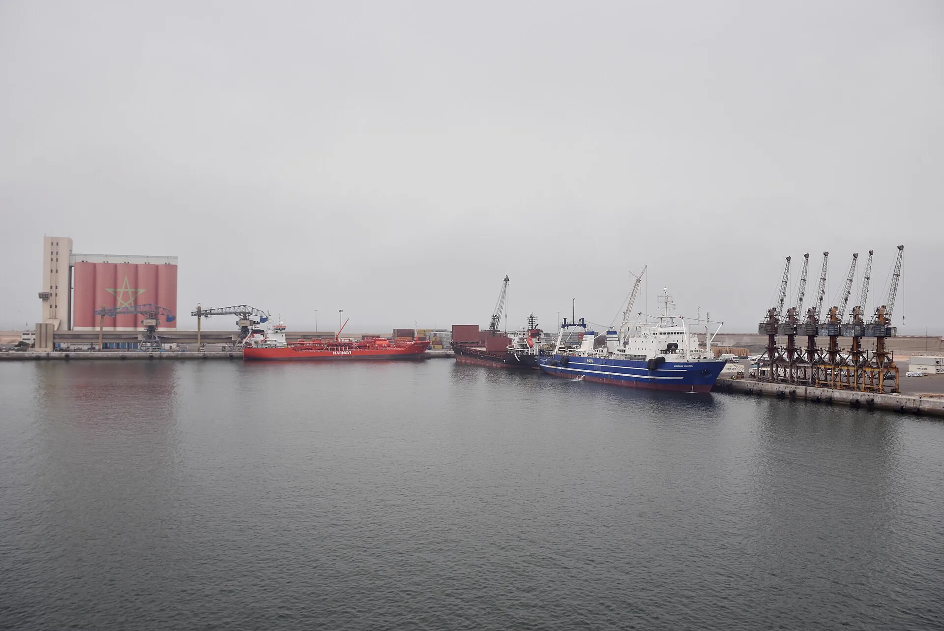 Ships at berth and cranes in the commercial port of Agadir